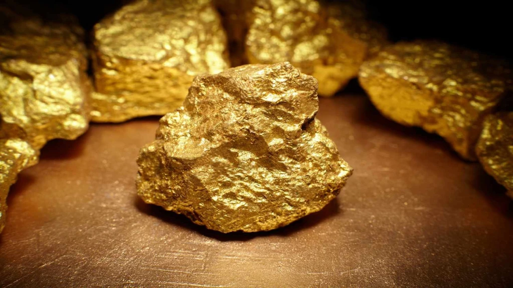 Gold jewellery and gold bars representing the projected gold price trend in India for December 2026.