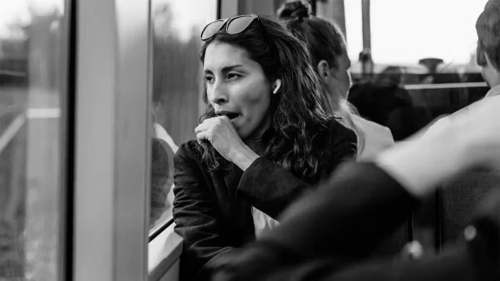 A person yawning, illustrating the scientific reasons behind yawning, including fatigue, sleep deprivation, and brain cooling.