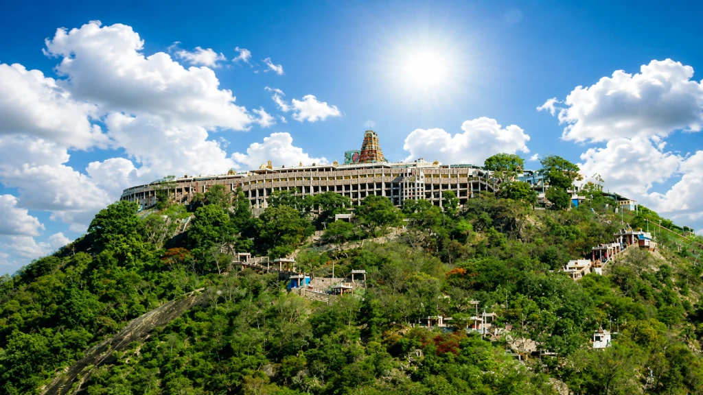 Entrance to Palani temple with a vehicle parking area, symbolizing the land registration controversy involving a temple-owned parking site.